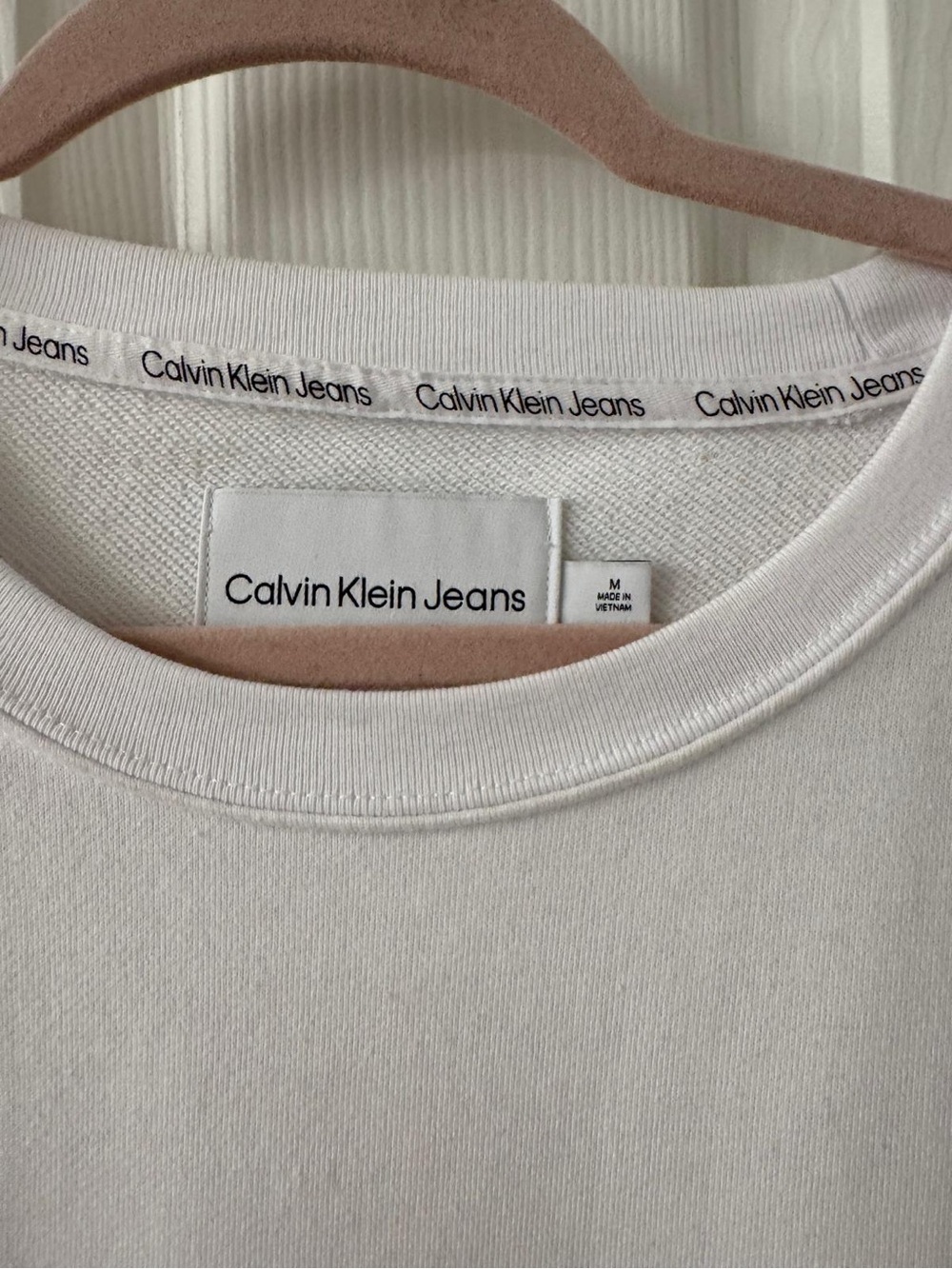Calvin Klein White Pullover Sweatshirt with Black Logo Patch Shoulder pads